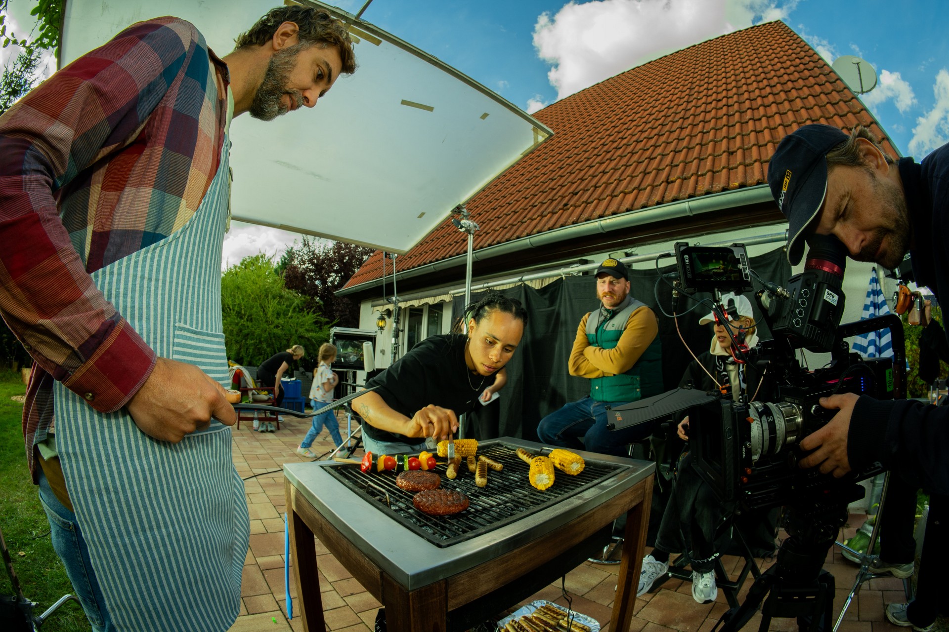 setup for a food commercial with the film crew, actors and director